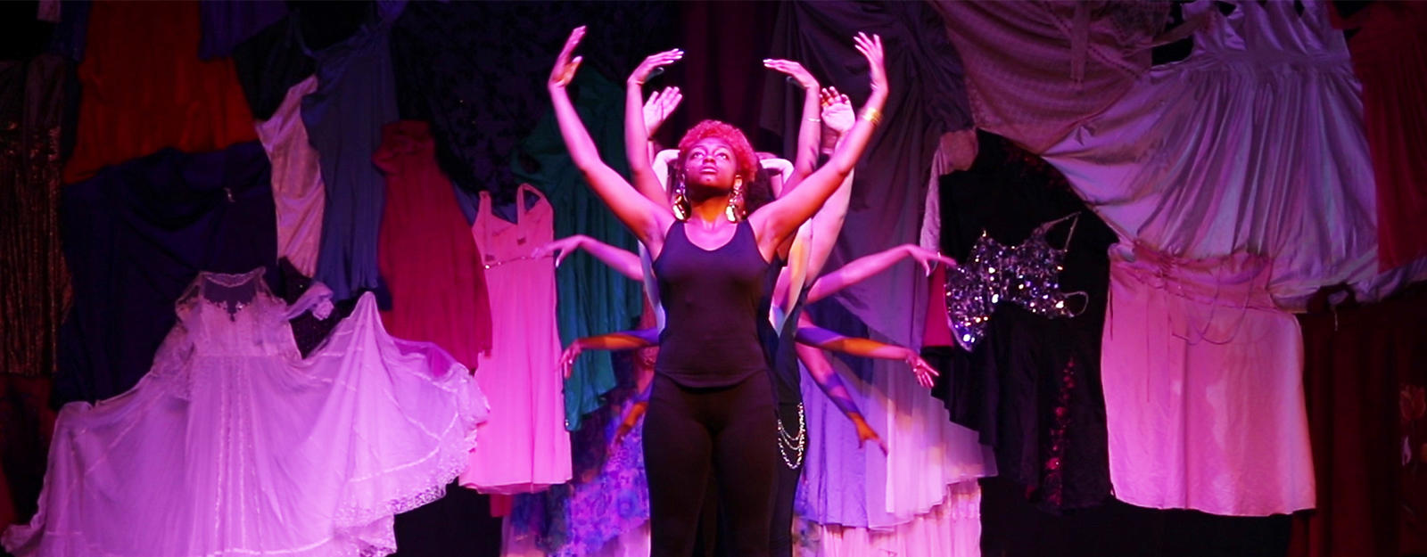 Students doing an interpretive dance during a performance.